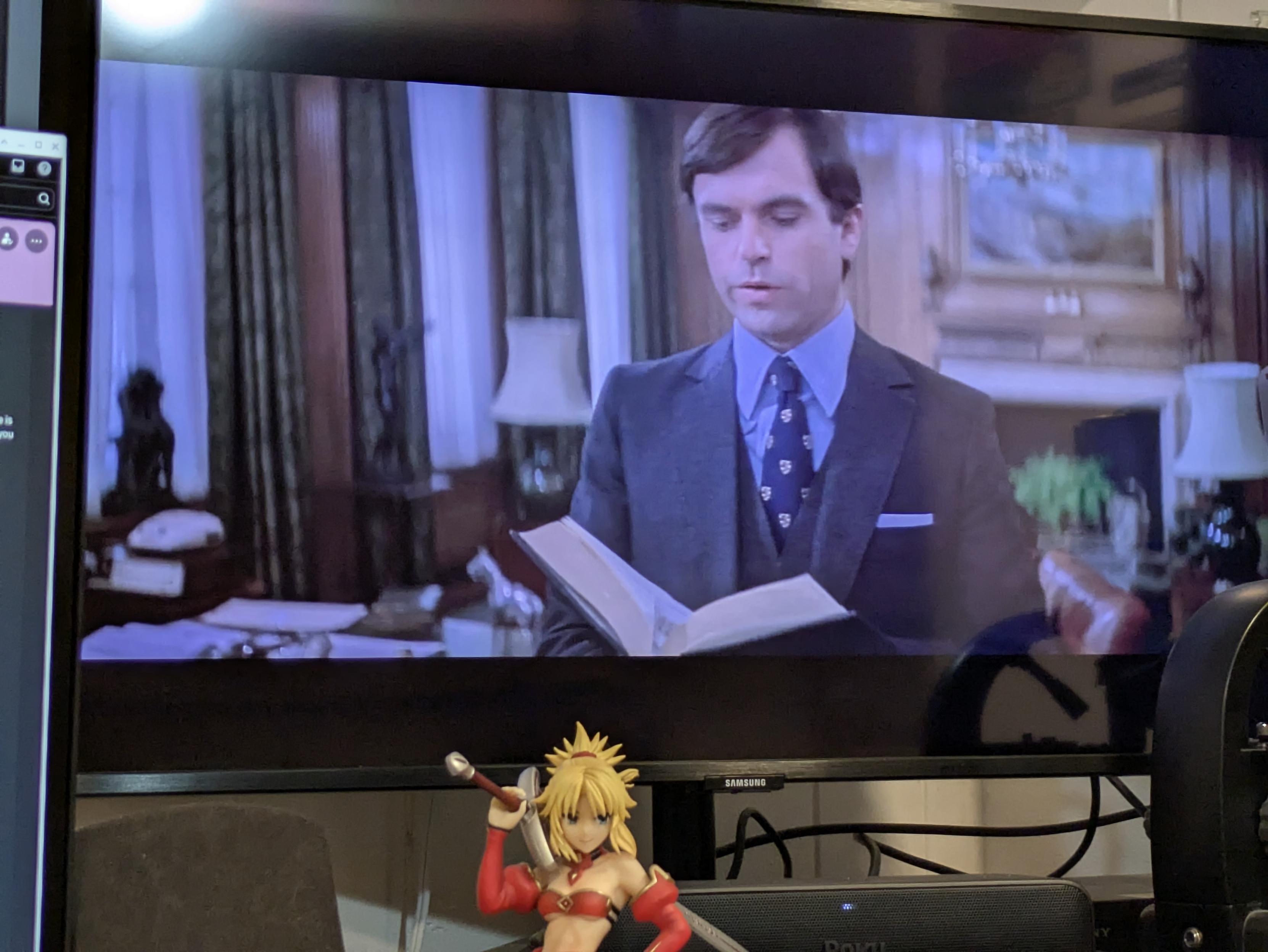 Sam Neill as the Antichrist, Damien Thorn, reading from a heavy Bible in an early scene from "The Omen III"